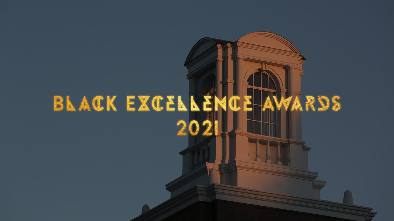 Black Excellence Awards gold text over Schar Hall cupola at sunset