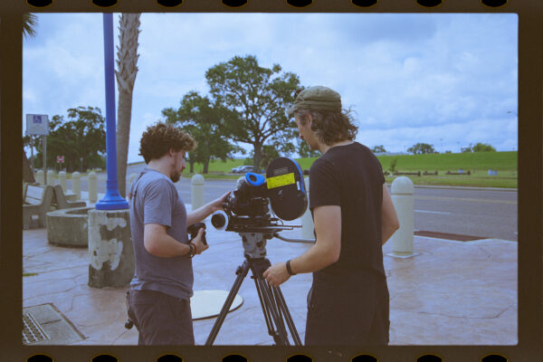 Casey Shaw and Ted Morée examine Arri film camera near Lake Pontchartrain